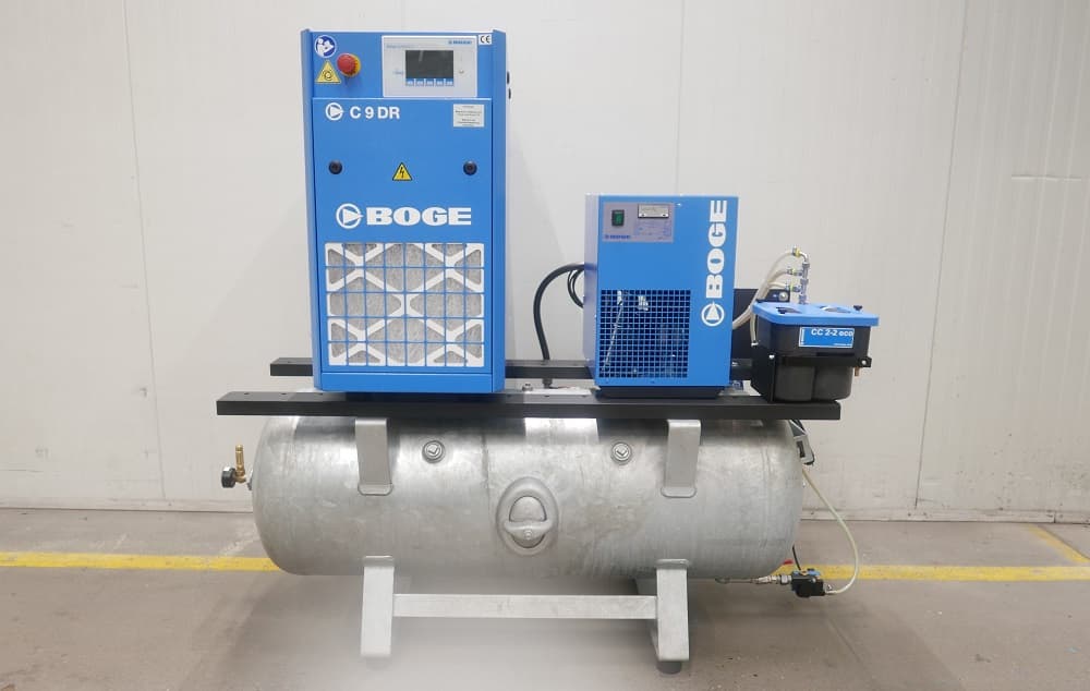 BOGE air compressor system with blue C 9 DR unit and accessories mounted on a metal receiver, in an industrial setting.