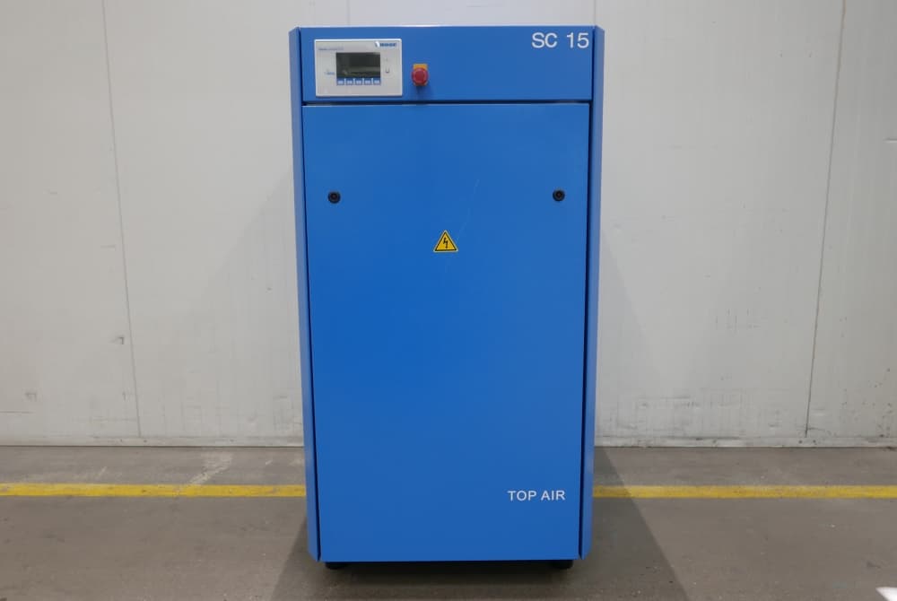 Blue industrial air compressor unit with control panel and safety warning, labeled "SC 15" and "TOP AIR," set against a plain background.
