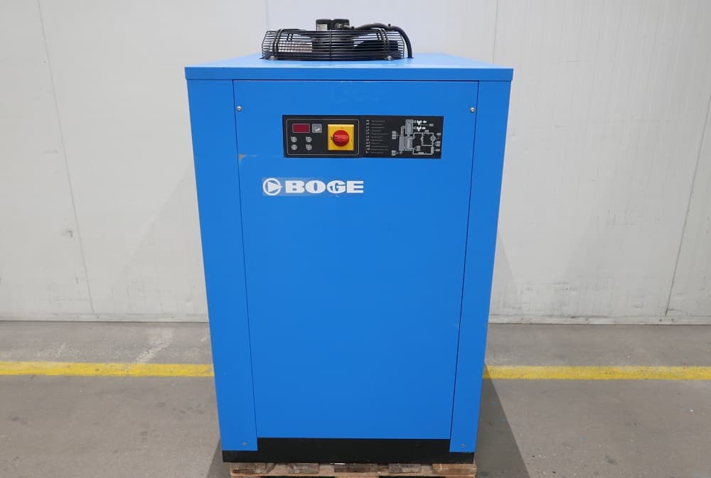 Blue BOGE air dryer unit with control panel, placed on a wooden pallet in an industrial setting.