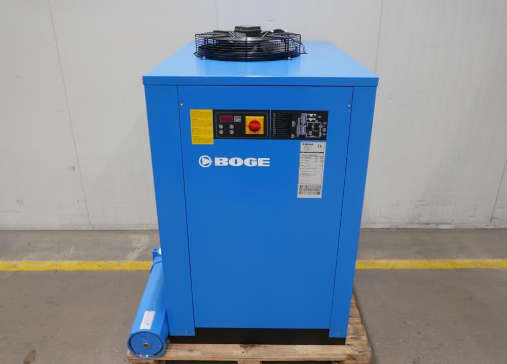BOGE air dryer unit in blue, featuring control panel and logo, placed on a wooden pallet in an industrial setting.
