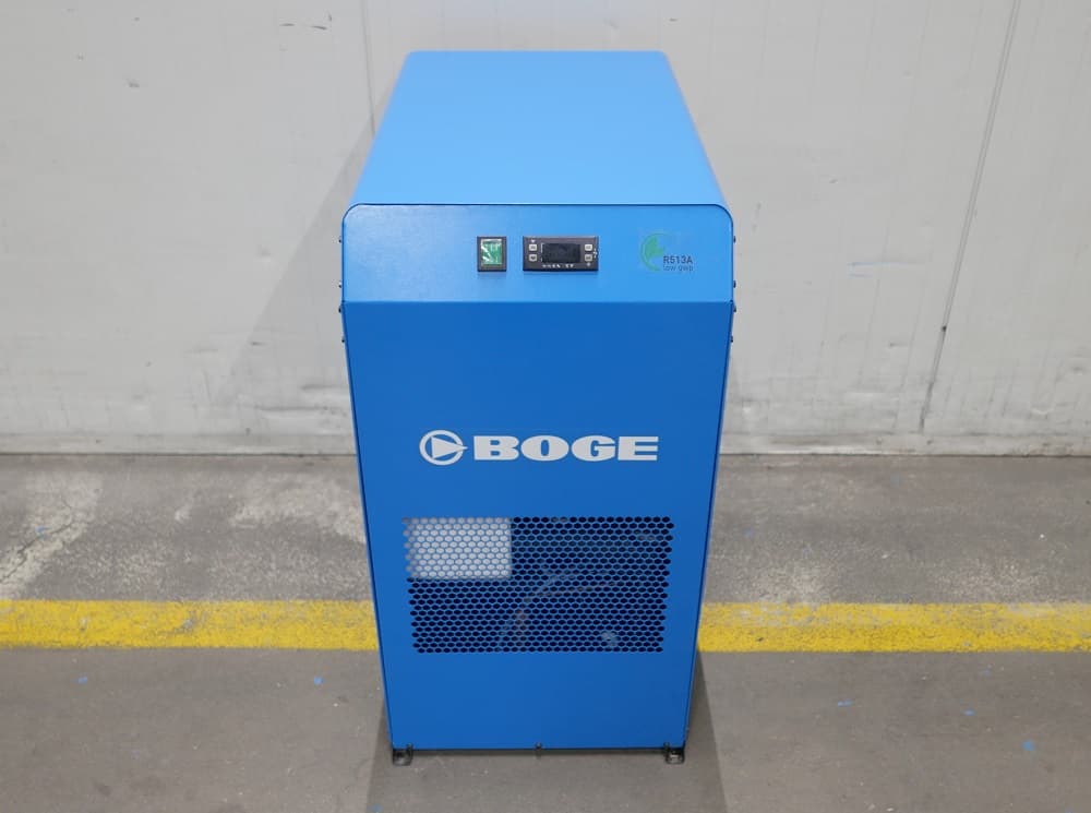 Blue BOGE refrigerant dryer with control panel, standing on a concrete floor against a white wall.