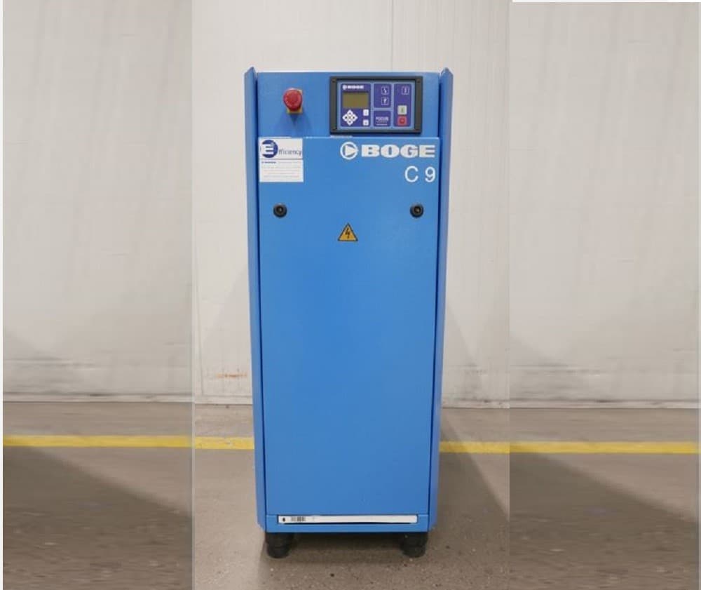BOGE C9 air compressor in a blue casing with control panel, standing on a concrete floor.