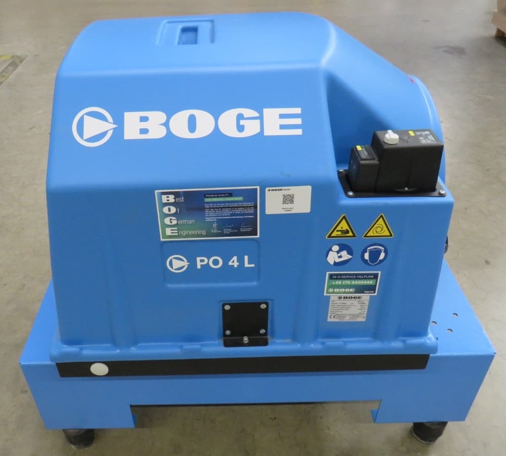 Blue BOGE PO 4 L air compressor on wheels, featuring control panel and safety labels, designed for efficient compressed air solutions.