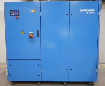 BOGE S 220 air compressor in blue, featuring control panel and safety warnings, designed for efficient compressed air solutions.
