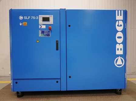 BOGE SLF 75-3 air compressor in blue casing, featuring a control panel and safety labels, designed for efficient compressed air solutions.
