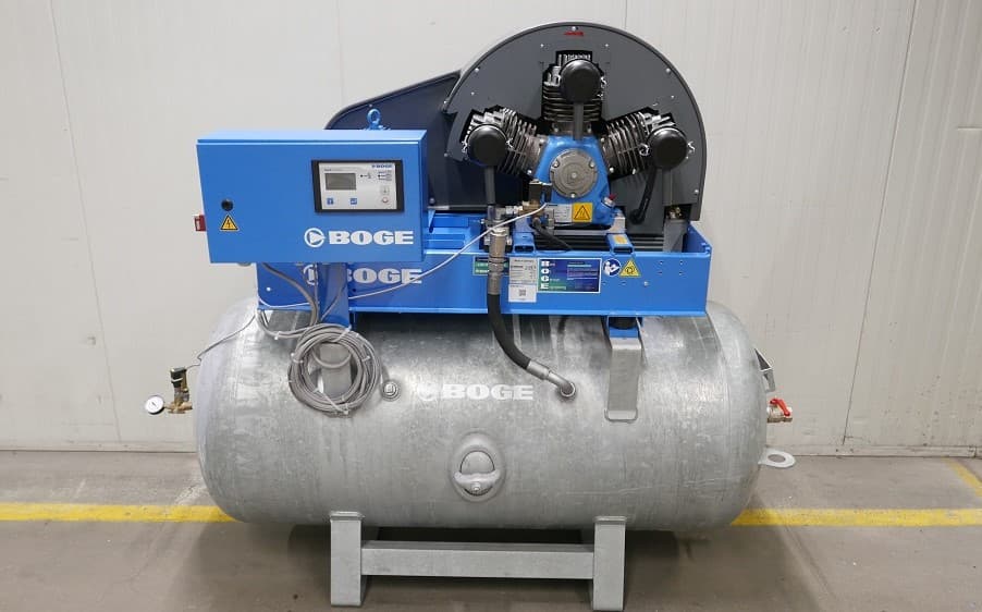 BOGE air compressor with blue control panel and silver receiver, designed for efficient compressed air solutions.