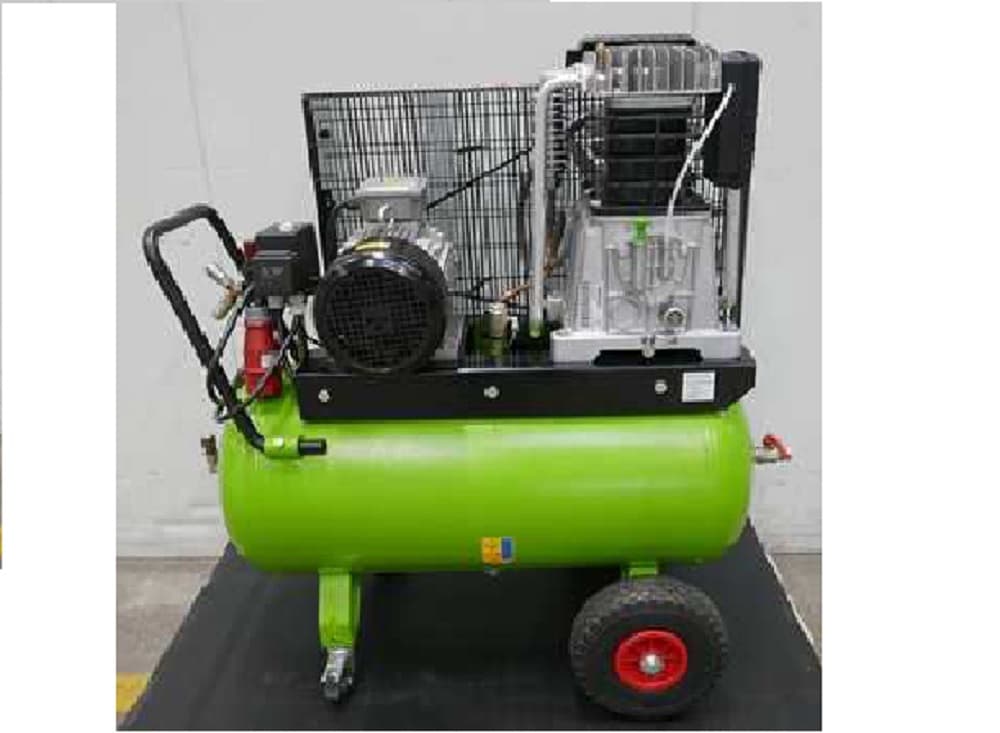 Green portable air compressor with a protective cage, mounted on wheels for easy mobility in industrial settings.
