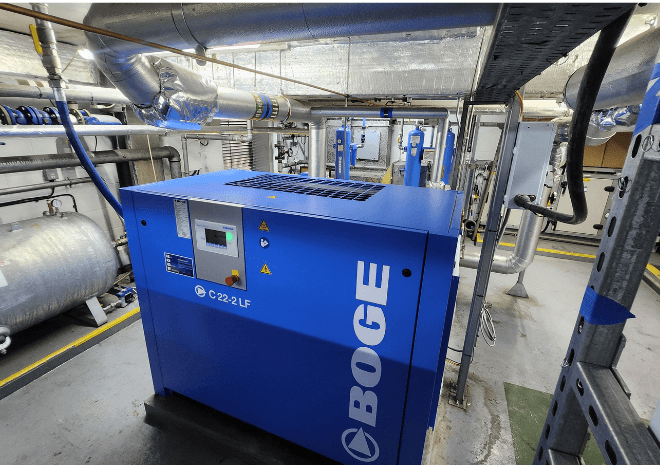 Blue BOGE C 22-2 LF screw compressor installed in the engine room onboard Queen Mary 2